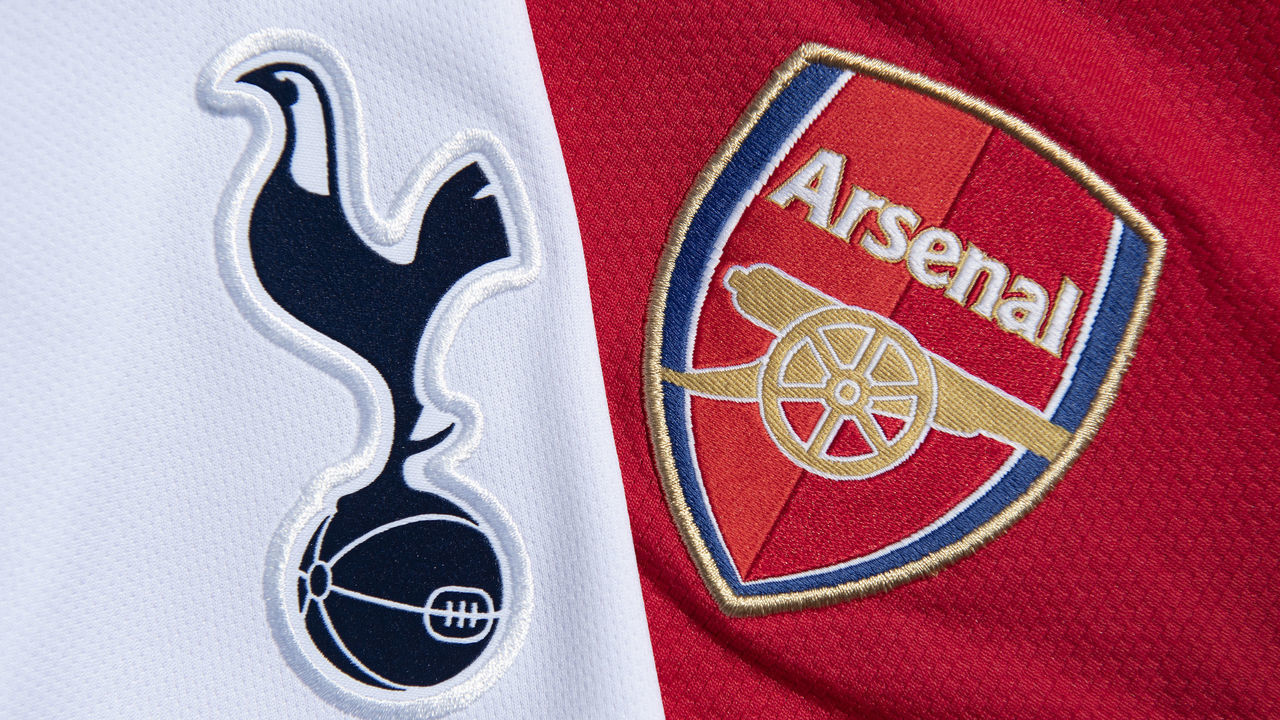 MANCHESTER, ENGLAND - MAY 13: The Tottenham Hotspur and Arsenal club crests on their first team home shirts on May 13, 2020 in Manchester, England.