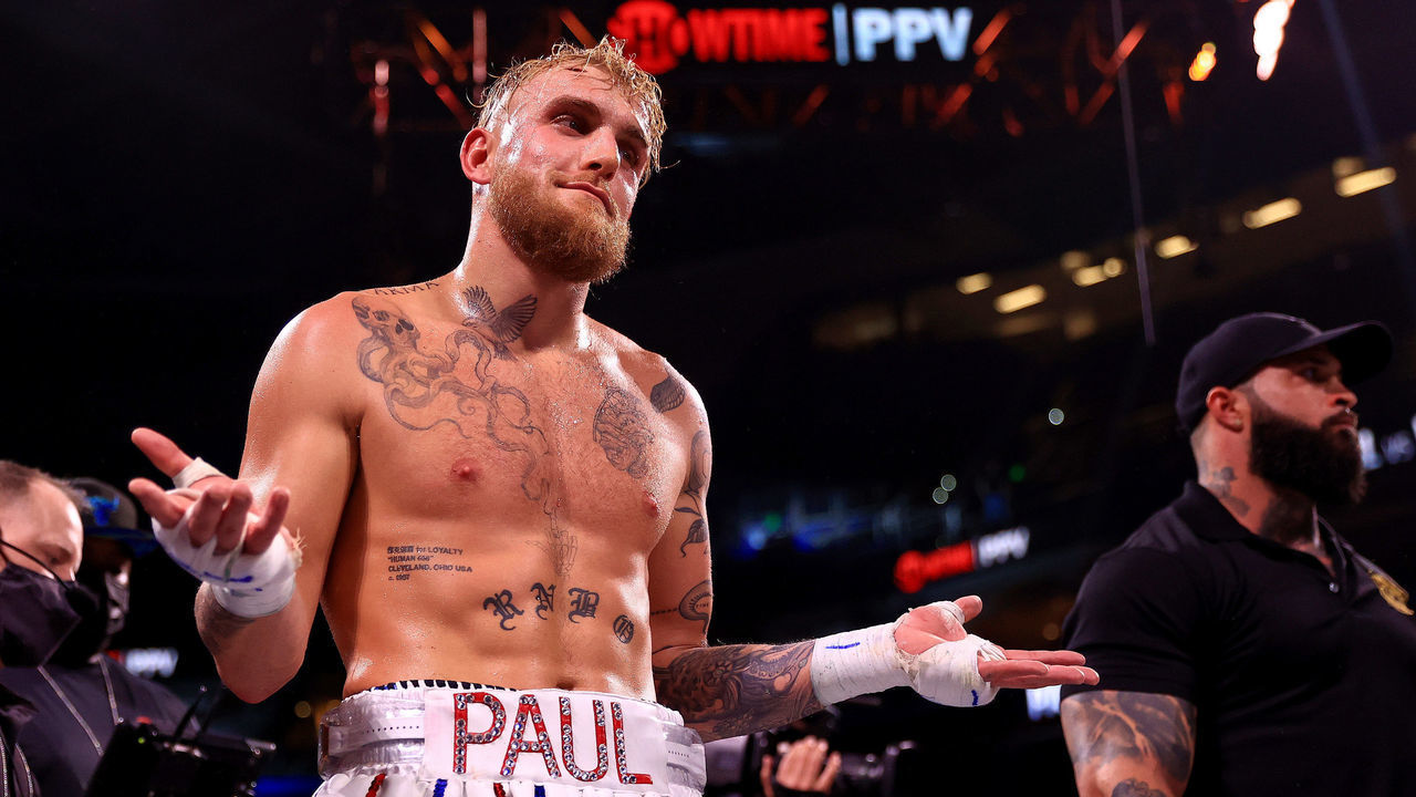 TAMPA, FLORIDA - DECEMBER 18: Jake Paul reacts to knocking out Tyron Woddley in the sixth round during an eight-round cruiserweight bout at the Amalie Arena on December 18, 2021 in Tampa, Florida.