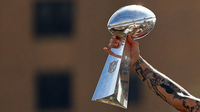 TAMPA, FLORIDA - FEBRUARY 10: Mike Evans #13 of the Tampa Bay Buccaneers celebrates their Super Bowl LV victory with the Vince Lombardi trophy during a boat parade through the city on February 10, 2021 in Tampa, Florida.