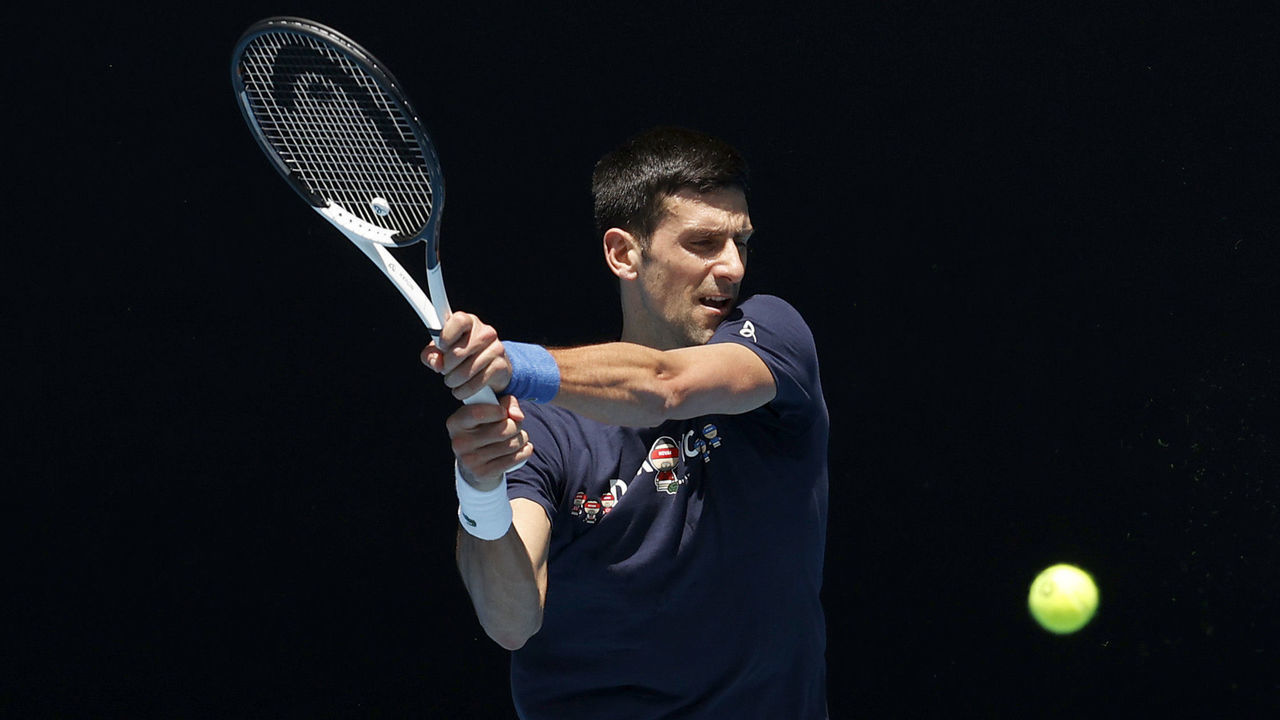 MELBOURNE, AUSTRALIA - JANUARY 12: Novak Djokovic of Serbia plays a backhand shot during a practice session ahead of the 2022 Australian Open at Melbourne Park on January 12, 2022 in Melbourne, Australia.