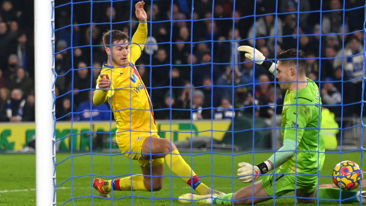 BRIGHTON, ENGLAND - JANUARY 14: Joachim Andersen of Crystal Palace scores an own goal past Jack Butland of Crystal Palace during the Premier League match between Brighton & Hove Albion and Crystal Palace at American Express Community Stadium on January 14, 2022 in Brighton, England.