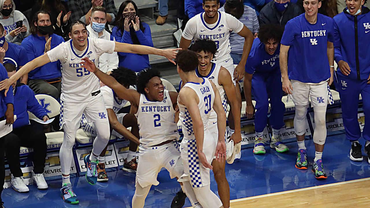 LEXINGTON, KY - DECEMBER 22: Kentucky Wildcats players guard Sahvir Wheeler (2), forward Jacob Toppin (0), and guard Kellan Grady (31) celebrate in a game between the Western Kentucky Hilltoppers and the Kentucky Wildcats on December 22, 2021, at Rupp Arena in Lexington, KY.