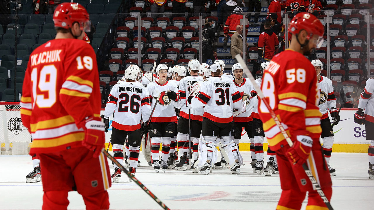 CALGARY, AB - JANUARY 13: The Ottawa Senators celebrate on ice after a win against the Calgary Flames at Scotiabank Saddledome on January 13, 2022 in Calgary, Alberta, Canada.