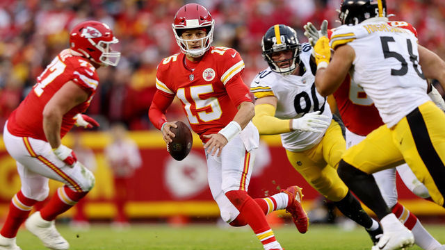 KANSAS CITY, MISSOURI - DECEMBER 26: Patrick Mahomes #15 of the Kansas City Chiefs is chased by T.J. Watt #90 and Alex Highsmith #56 of the Pittsburgh Steelers during the second quarter at Arrowhead Stadium on December 26, 2021 in Kansas City, Missouri.