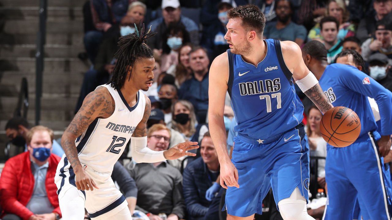 MEMPHIS, TN - JANUARY 14: Ja Morant #12 of the Memphis Grizzlies plays defense on Luka Doncic #77 of the Dallas Mavericks during the game on January 14, 2022 at FedExForum in Memphis, Tennessee. Mandatory Copyright Notice: Copyright 2022 NBAE