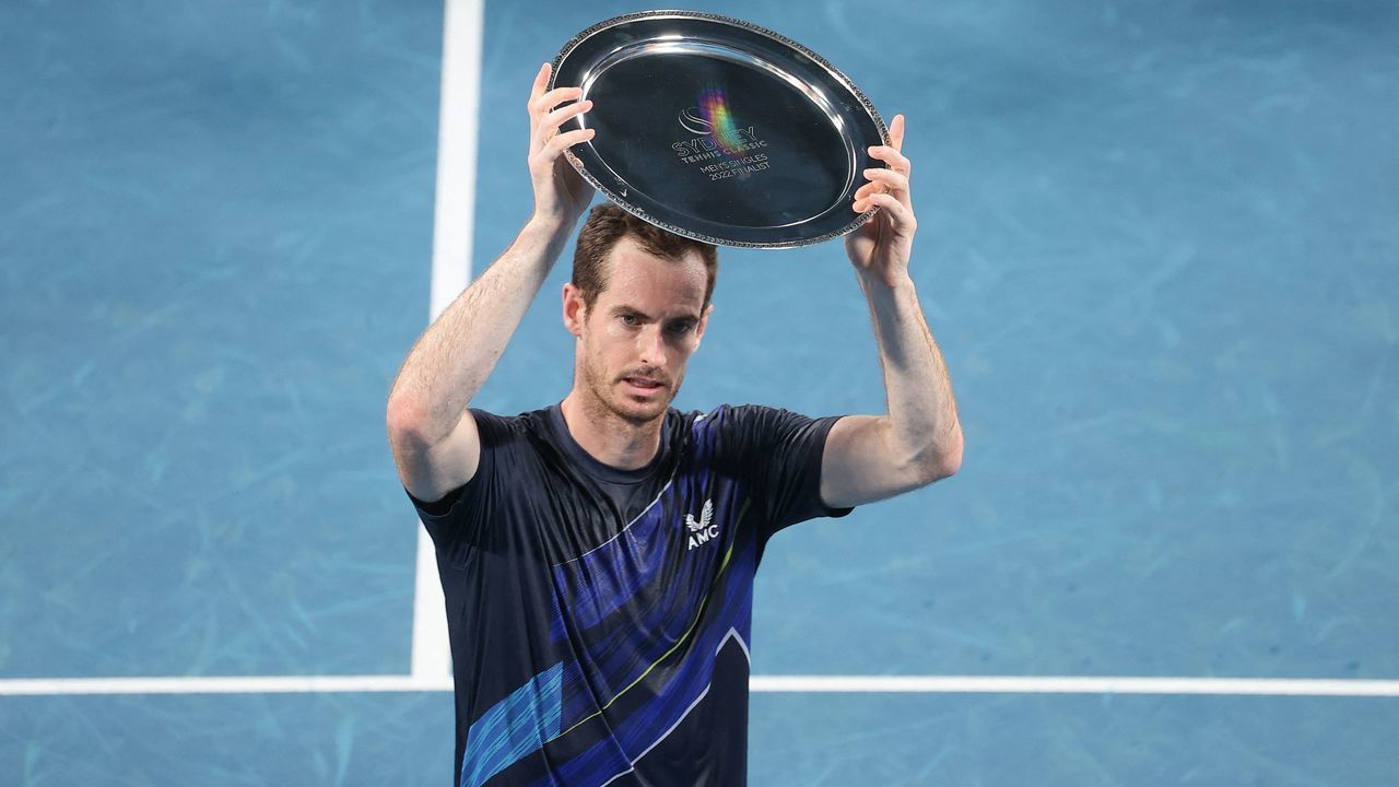 Andy Murray of Britain holds the runner's up trophy after losing to Aslan Karatsev of Russia in the men's singles final match at the Sydney Classic tennis tournament in Sydney on January 15, 2022. - - -- IMAGE RESTRICTED TO EDITORIAL USE - STRICTLY NO COMMERCIAL USE --