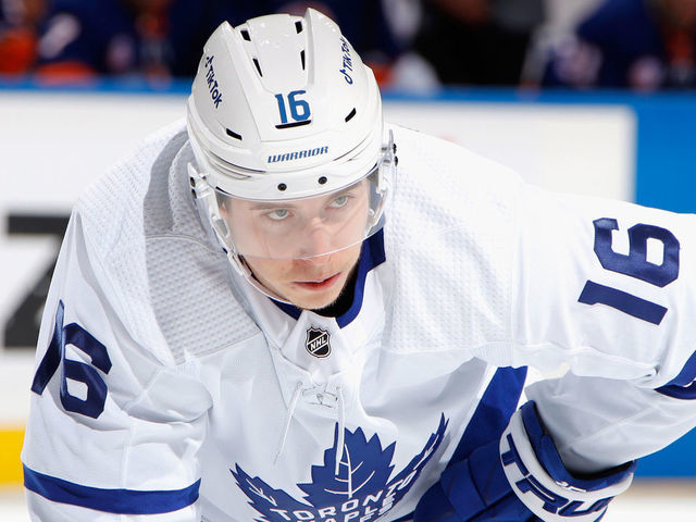 ELMONT, NEW YORK - NOVEMBER 21: Mitchell Marner #16 of the Toronto Maple Leafs skates against the New York Islanders at the UBS Arena on November 21, 2021 in Elmont, New York.