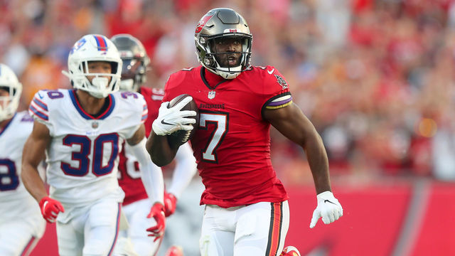 TAMPA, FL - DECEMBER 12: Tampa Bay Buccaneers Running Back Leonard Fournette (7) runs the ball to the end zone for a touchdown during the regular season game between the Buffalo Bills and the Tampa Bay Buccaneers on December 12, 2021 at Raymond James Stadium in Tampa, Florida.