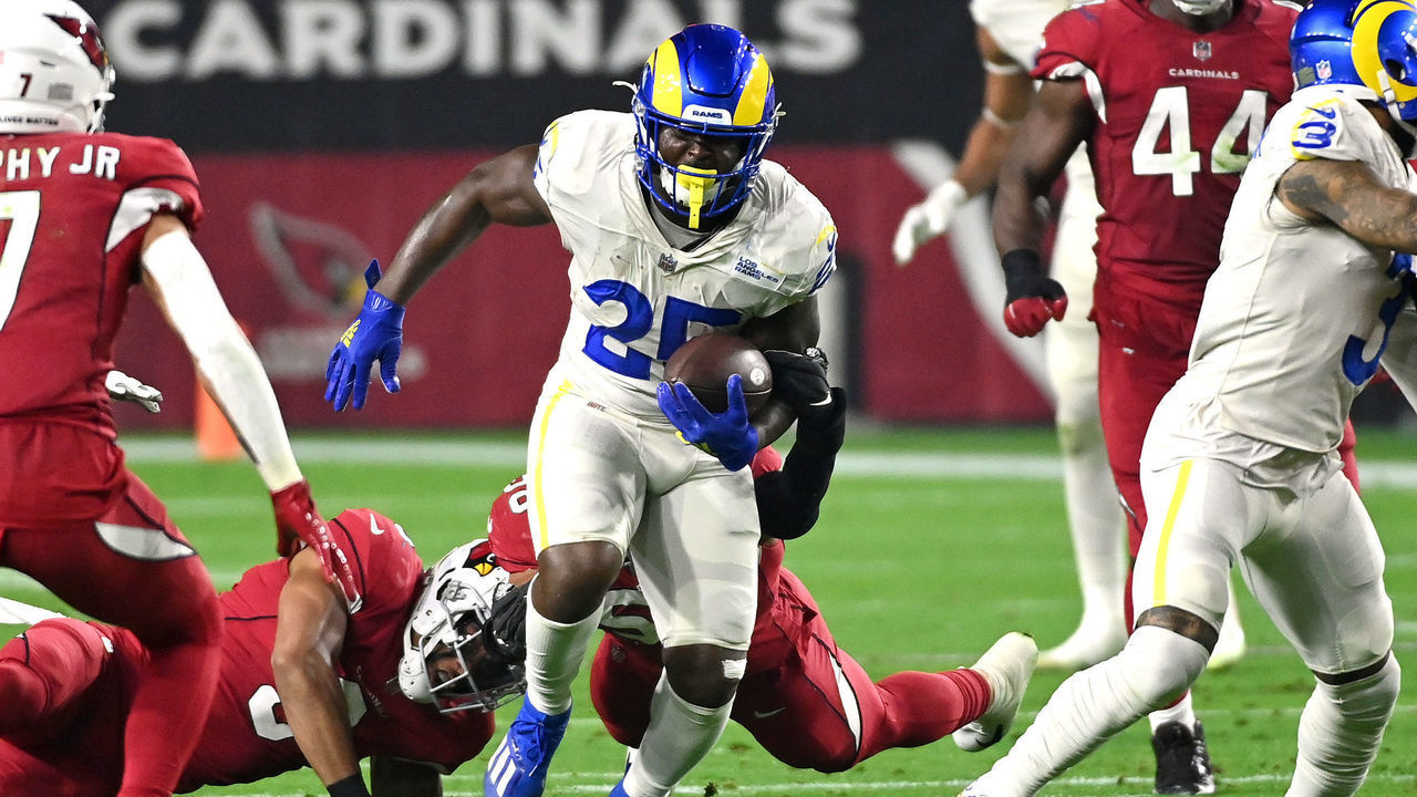 GLENDALE, ARIZONA - DECEMBER 13: Sony Michel #25 of the Los Angeles Rams rushes the ball in the first quarter of the game against the Los Angeles Rams at State Farm Stadium on December 13, 2021 in Glendale, Arizona.