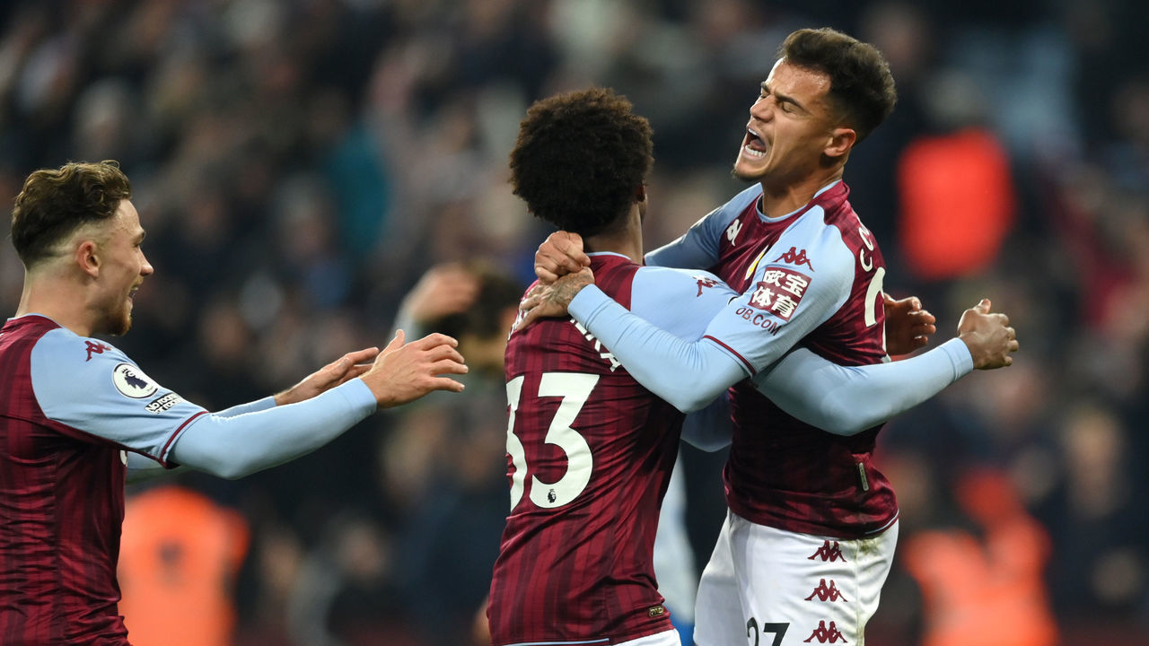 BIRMINGHAM, ENGLAND - JANUARY 15: Philippe Coutinho of Aston Villa celebrates with teammate Carney Chukwuemeka after scoring their side's second goal during the Premier League match between Aston Villa and Manchester United at Villa Park on January 15, 2022 in Birmingham, England.