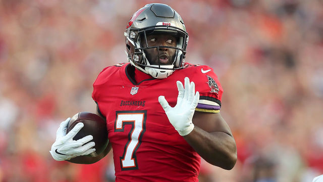 TAMPA, FL - DECEMBER 12: Tampa Bay Buccaneers Running Back Leonard Fournette (7) runs the ball to the end zone for a touchdown during the regular season game between the Buffalo Bills and the Tampa Bay Buccaneers on December 12, 2021 at Raymond James Stadium in Tampa, Florida.
