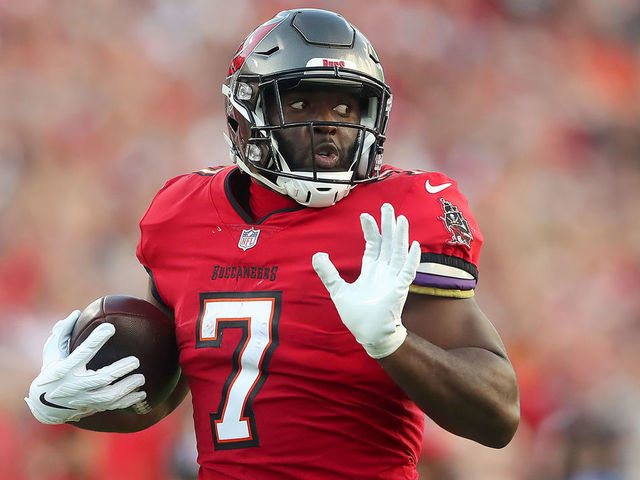 TAMPA, FL - DECEMBER 12: Tampa Bay Buccaneers Running Back Leonard Fournette (7) runs the ball to the end zone for a touchdown during the regular season game between the Buffalo Bills and the Tampa Bay Buccaneers on December 12, 2021 at Raymond James Stadium in Tampa, Florida.