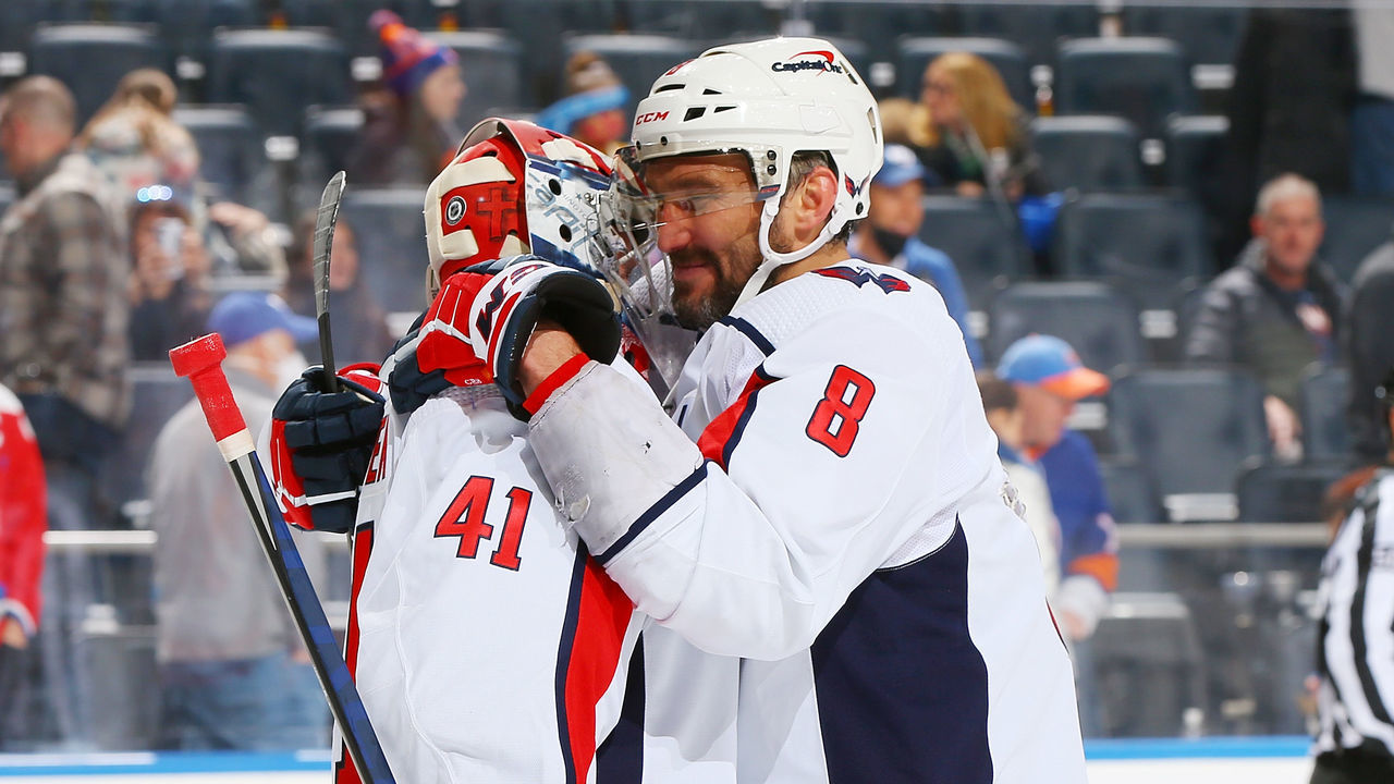 ELMONT, NEW YORK - JANUARY 15: Alex Ovechkin #8 and Vitek Vanecek #41 of the Washington Capitals celebrate after defeating the New York Islanders 2-0 at UBS Arena on January 15, 2022 in Elmont, New York.
