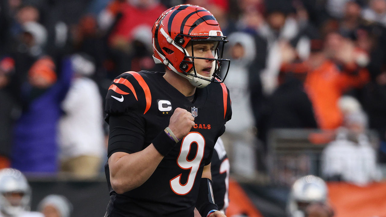 CINCINNATI, OHIO - JANUARY 15: Quarterback Joe Burrow #9 of the Cincinnati Bengals celebrates after throwing a first half touchdown pass against the Las Vegas Raiders during the AFC Wild Card playoff game at Paul Brown Stadium on January 15, 2022 in Cincinnati, Ohio.