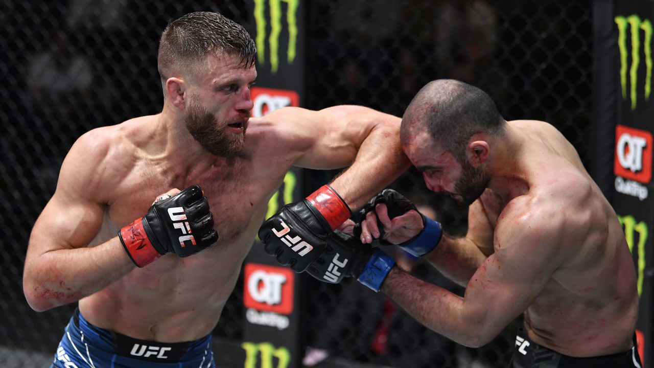 LAS VEGAS, NEVADA - JANUARY 15: (L-R) Calvin Kattar elbows Giga Chikadze of Georgia in their featherweight fight during the UFC Fight Night event at UFC APEX on January 15, 2022 in Las Vegas, Nevada.