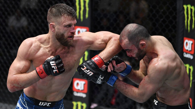 LAS VEGAS, NEVADA - JANUARY 15: (L-R) Calvin Kattar elbows Giga Chikadze of Georgia in their featherweight fight during the UFC Fight Night event at UFC APEX on January 15, 2022 in Las Vegas, Nevada.