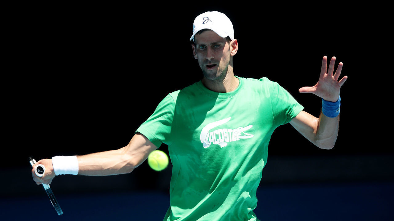 MELBOURNE, AUSTRALIA - JANUARY 13: Novak Djokovic of Serbia plays a forehand during a practice session ahead of the 2022 Australian Open at Melbourne Park on January 13, 2022 in Melbourne, Australia.