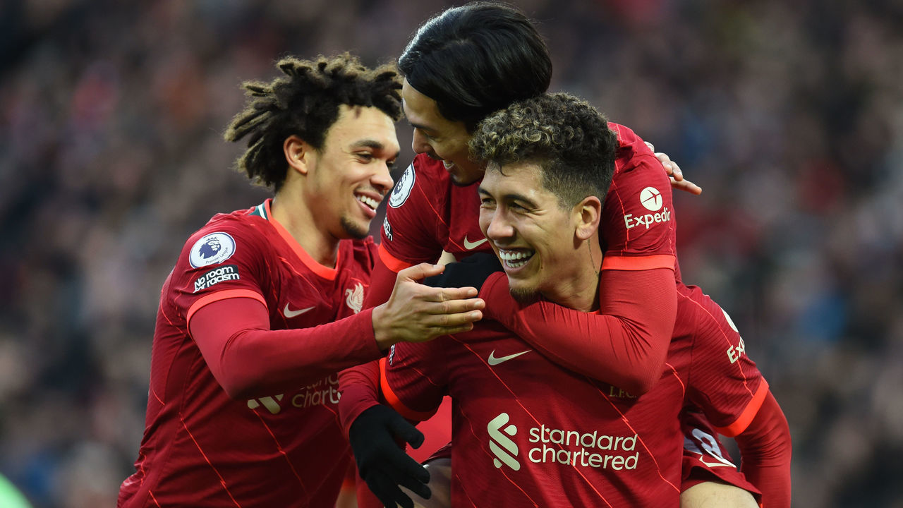 LIVERPOOL, ENGLAND - JANUARY 16:( THE SUN OUT,THE SUN ON SUNDAY OUT) Takumi Minamino of Liverpool celebrates after scoring the third goal during the Premier League match between Liverpool and Brentford at Anfield on January 16, 2022 in Liverpool, England.