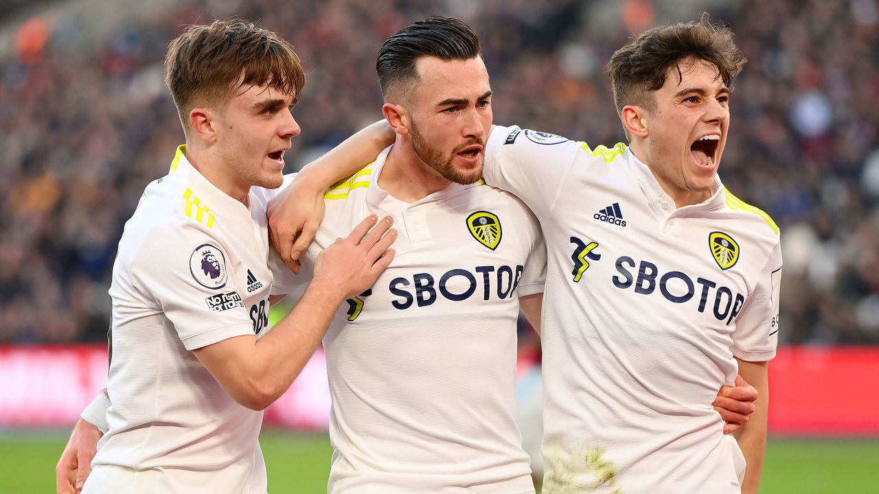 LONDON, ENGLAND - JANUARY 16: Jack Harrison celebrates with Lewis Bate and Daniel James of Leeds Unitedafter scoring their team's third goal during the Premier League match between West Ham United and Leeds United at London Stadium on January 16, 2022 in London, England.