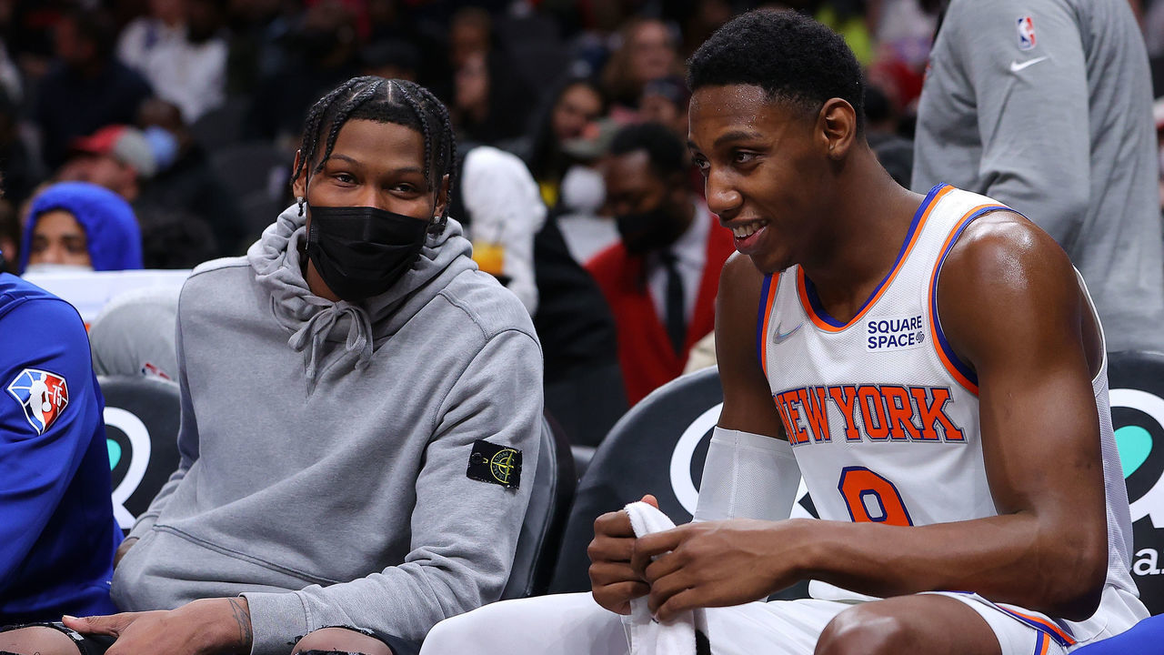 ATLANTA, GEORGIA - JANUARY 15: RJ Barrett #9 and Cam Reddish #21 of the New York Knicks converse on the bench against the Atlanta Hawks during the second half at State Farm Arena on January 15, 2022 in Atlanta, Georgia. Reddish was just traded to the Knicks on January 13, 2022.