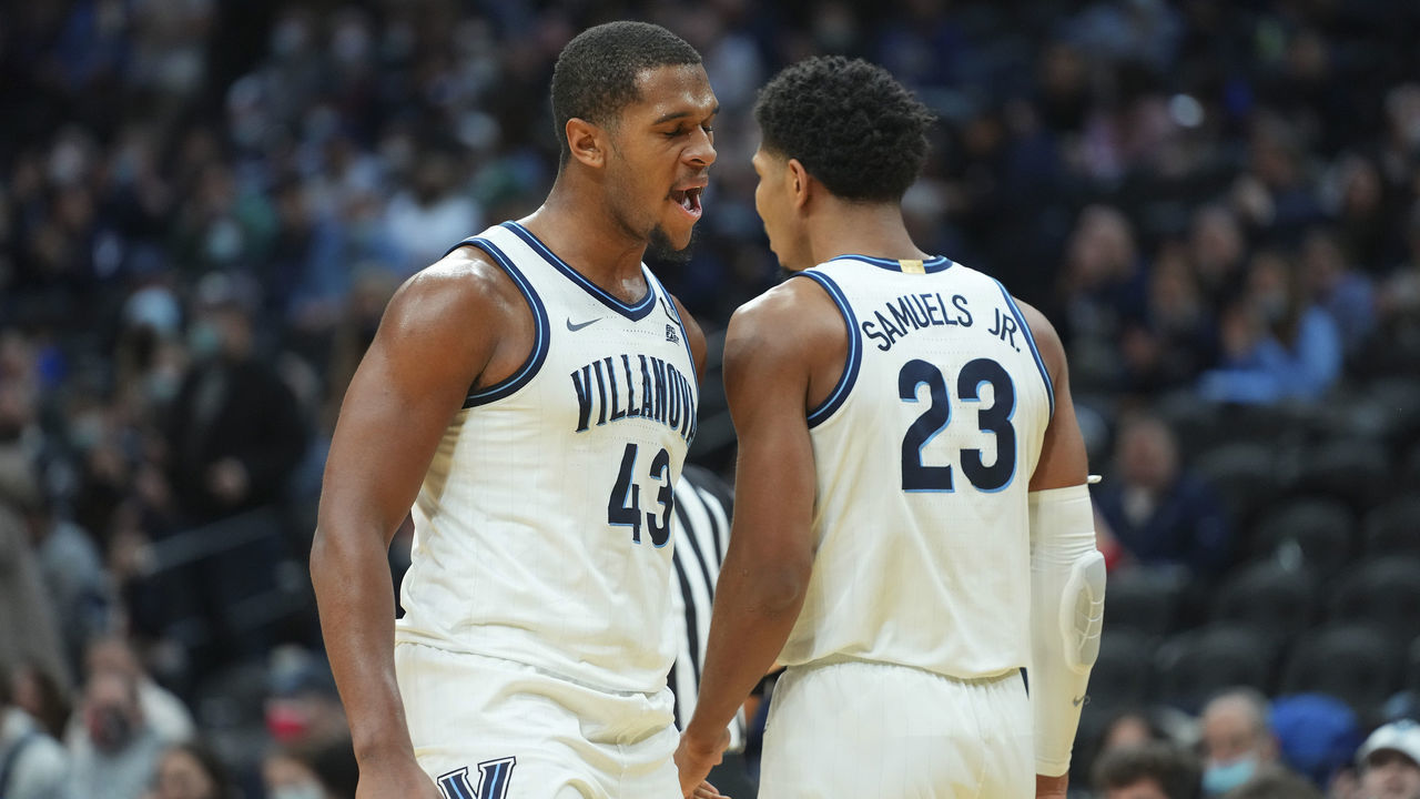 PHILADELPHIA, PA - JANUARY 16: Eric Dixon #43 and Jermaine Samuels #23 of the Villanova Wildcats react against the Butler Bulldogs in the second half at the Wells Fargo Center on January 16, 2022 in Philadelphia, Pennsylvania.