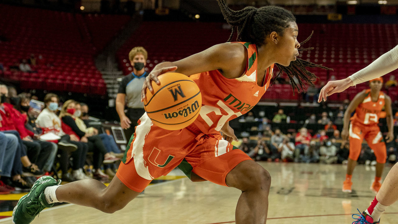 COLLEGE PARK, MD - DECEMBER 02: Maryland Terrapins forward Chloe Bibby (55) defends against Miami Hurricanes guard Kelsey Marshall (20) during a womens college basketball game between the Maryland Terrapins and the Miami Hurricanes, on December 02, 2021, at Xfinity Center, in College Park, Maryland.