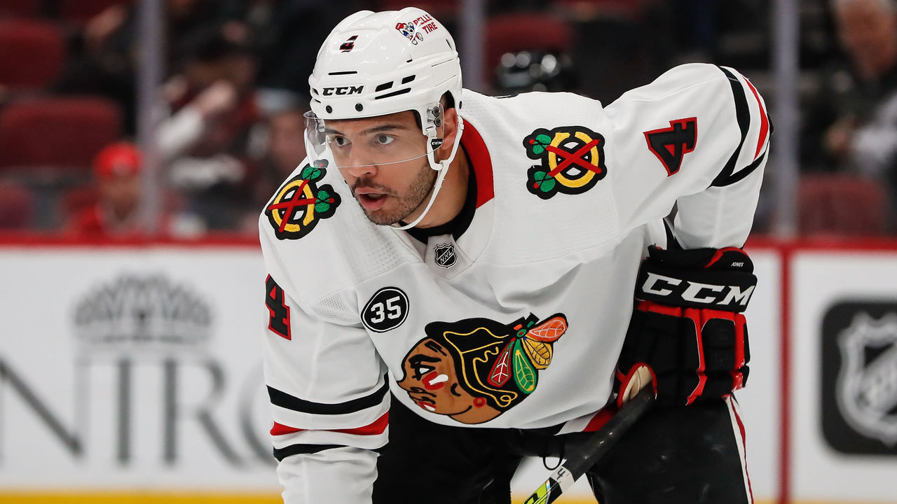 GLENDALE, AZ - JANUARY 06: Chicago Blackhawks defenseman Seth Jones (4) looks on during the NHL hockey game between the Chicago Blackhawks and the Arizona Coyotes on January 6, 2022 at Gila River Arena in Glendale, Arizona.
