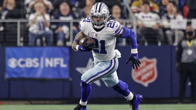 ARLINGTON, TX - JANUARY 16: Dallas Cowboys running back Ezekiel Elliott (21) runs for a first down during the NFC Wild Card game between the Dallas Cowboys and the San Francisco 49ers on January 16, 2022 at AT&T Stadium in Arlington, Texas.