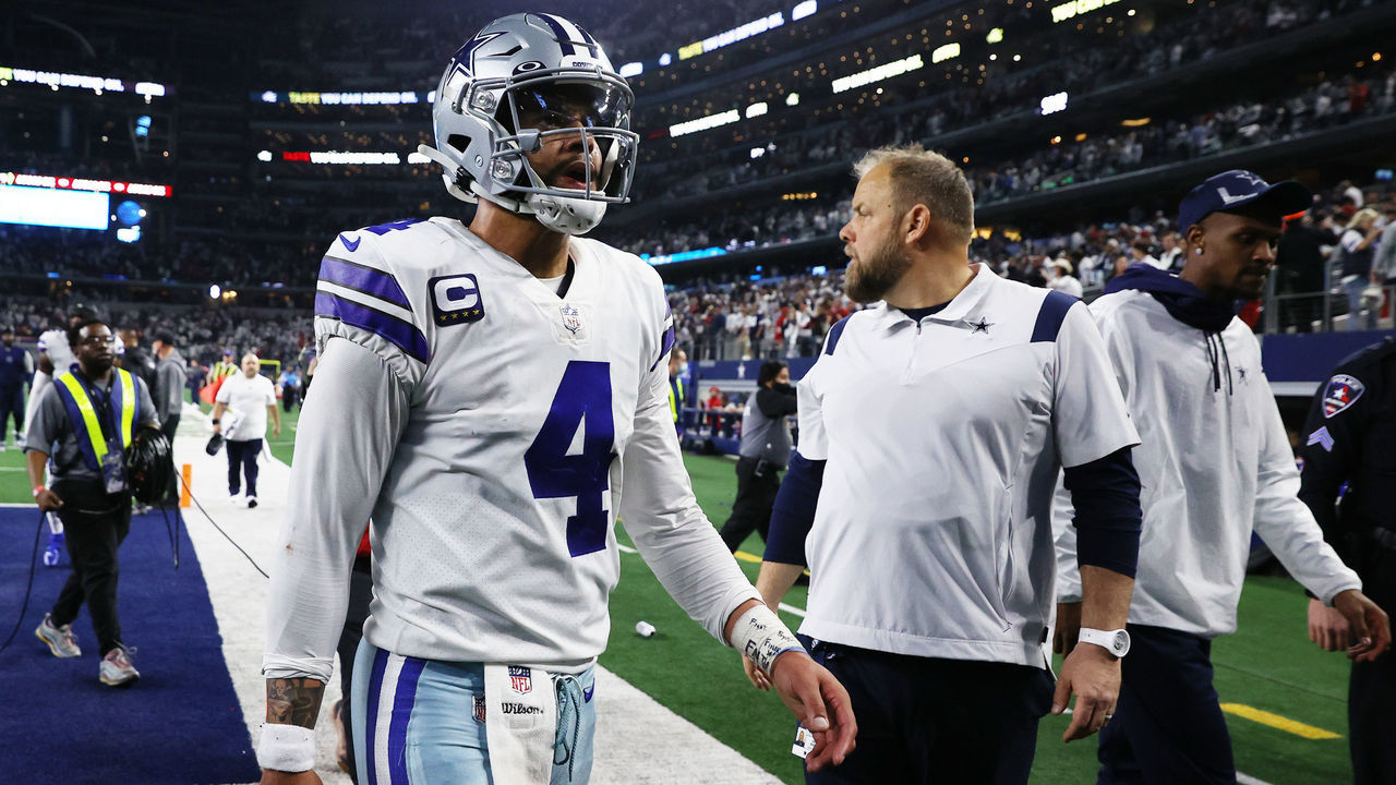ARLINGTON, TEXAS - JANUARY 16: Dak Prescott #4 of the Dallas Cowboys walks off the field after losing to the San Francisco 49ers 23-17 in the NFC Wild Card Playoff game at AT&T Stadium on January 16, 2022 in Arlington, Texas.