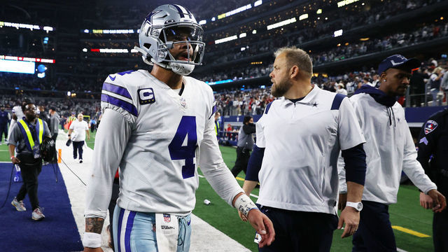 ARLINGTON, TEXAS - JANUARY 16: Dak Prescott #4 of the Dallas Cowboys walks off the field after losing to the San Francisco 49ers 23-17 in the NFC Wild Card Playoff game at AT&T Stadium on January 16, 2022 in Arlington, Texas.