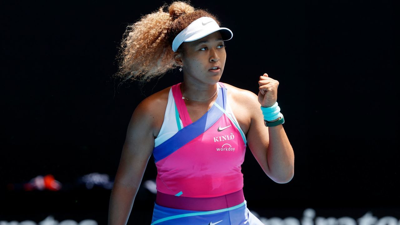 Japan's Naomi Osaka celebrates her match point against Colombia's Camila Osorio during their women's singles match on day one of the Australian Open tennis tournament in Melbourne on January 17, 2022. - -- IMAGE RESTRICTED TO EDITORIAL USE - STRICTLY NO COMMERCIAL USE --