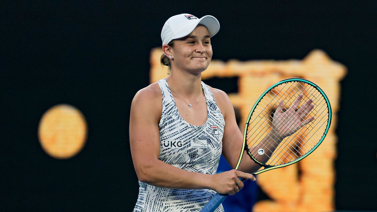 MELBOURNE, AUSTRALIA - JANUARY 17: Ashleigh Barty of Australia celebrates winning match point in her first round singles match against Lesia Tsurenko of Ukraine during day one of the 2022 Australian Open at Melbourne Park on January 17, 2022 in Melbourne, Australia.