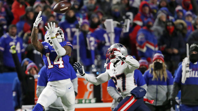 Orchard Park, NY - January 15: Buffalo Bills WR Stefon Diggs hauls in a long pass from quarterback Josh Allen (not pictured) that beat Patriots DB J.C. Jackson (27) and gave Buffalo a first and ten on the Patriots 25 yard line in the second quarter. The Buffalo Bills host the New England Patriots in a AFC wild-card game Saturday night January 15, 2022 at Highmark Stadium in Orchard Park, NY.
