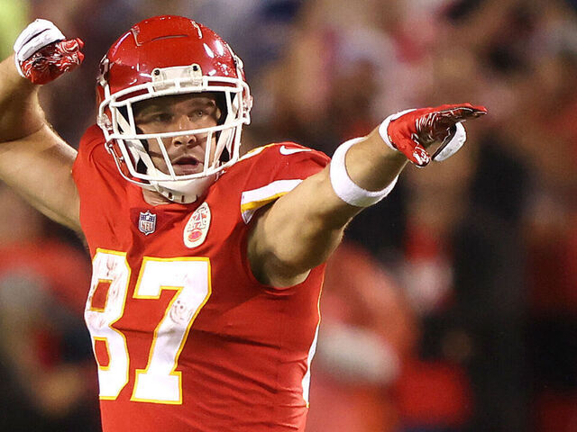 KANSAS CITY, MISSOURI - OCTOBER 10: Travis Kelce #87 of the Kansas City Chiefs motions first down after making a pass reception during the second half of a game against the Buffalo Bills at Arrowhead Stadium on October 10, 2021 in Kansas City, Missouri.