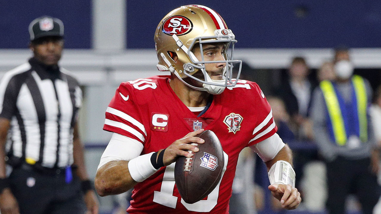 ARLINGTON, TEXAS - JANUARY 16: Jimmy Garoppolo #10 of the San Francisco 49ers scrambles against the Dallas Cowboys during the third quarter in the NFC Wild Card Playoff game at AT&T Stadium on January 16, 2022 in Arlington, Texas.