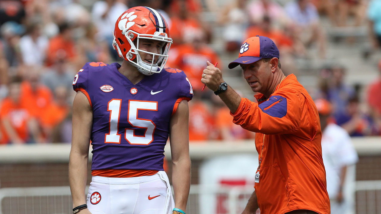 CLEMSON, SC - APRIL 14: Hunter Johnson (15) listens to head coach Dabo Swinney between plays at the Clemson Spring Football game at Clemson Memorial Stadium on April 14, 2018 in Clemson, SC..