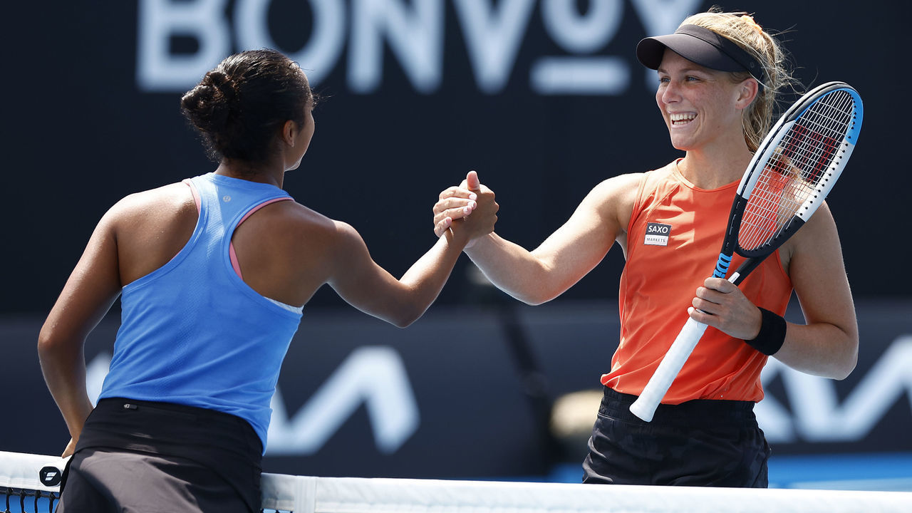 MELBOURNE, AUSTRALIA - JANUARY 18: Maddison Inglis of Australia shakes hands with Leylah Fernandez of Canada after winning her first round singles match during day two of the 2022 Australian Open at Melbourne Park on January 18, 2022 in Melbourne, Australia.