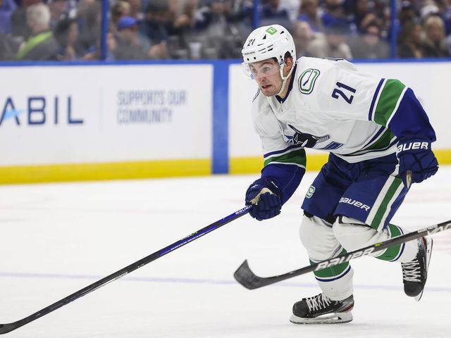 TAMPA, FL - JANUARY 13: Nils Hoglander #21 of the Vancouver Canucks during the second period against the Tampa Bay Lightning at Amalie Arena on January 13, 2022 in Tampa, Florida.