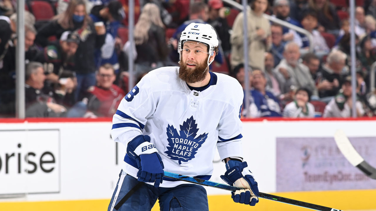 GLENDALE, ARIZONA - JANUARY 12: Jake Muzzin #8 of the Toronto Maple Leafs skates up ice against the Arizona Coyotes at Gila River Arena on January 12, 2022 in Glendale, Arizona.
