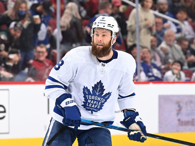 GLENDALE, ARIZONA - JANUARY 12: Jake Muzzin #8 of the Toronto Maple Leafs skates up ice against the Arizona Coyotes at Gila River Arena on January 12, 2022 in Glendale, Arizona.