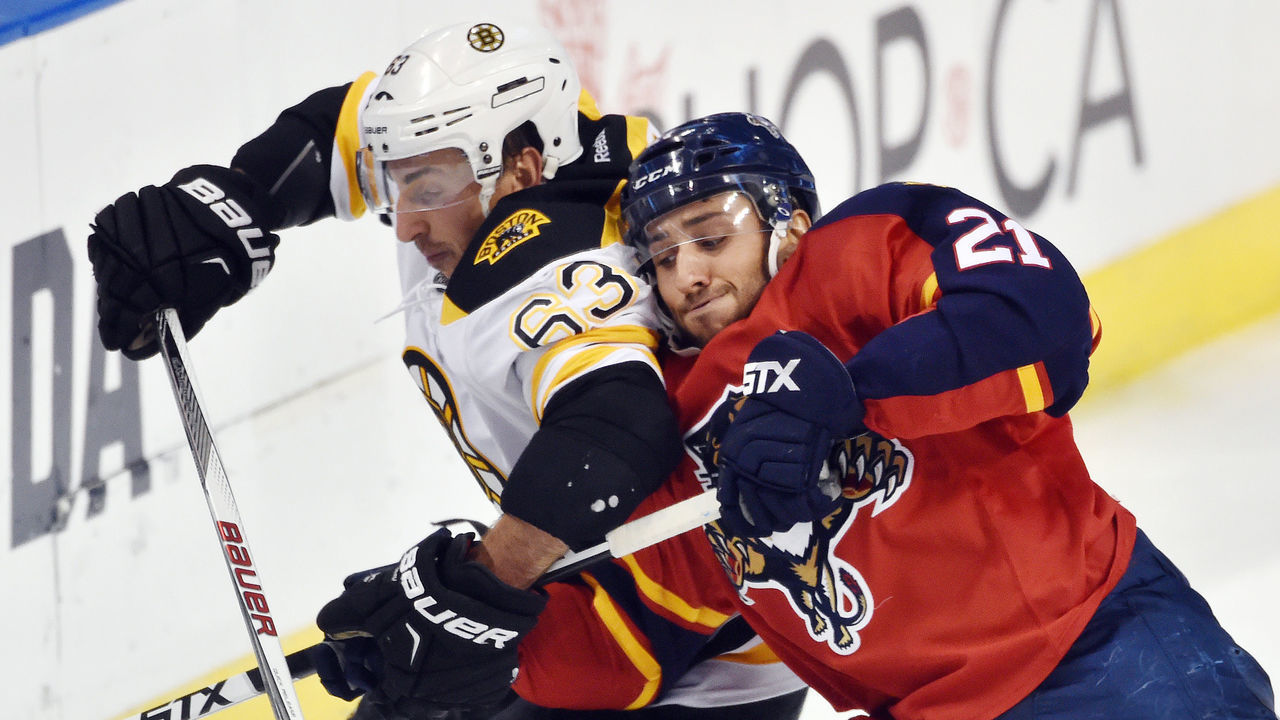 SUNRISE, FL - OCTOBER 30: Brad Marchand #63 of the Boston Bruins crosses sticks with Vincent Trocheck #21 of the Florida Panthers during a NHL game at the BB&T Center on October 30, 2015 in Sunrise, Florida.