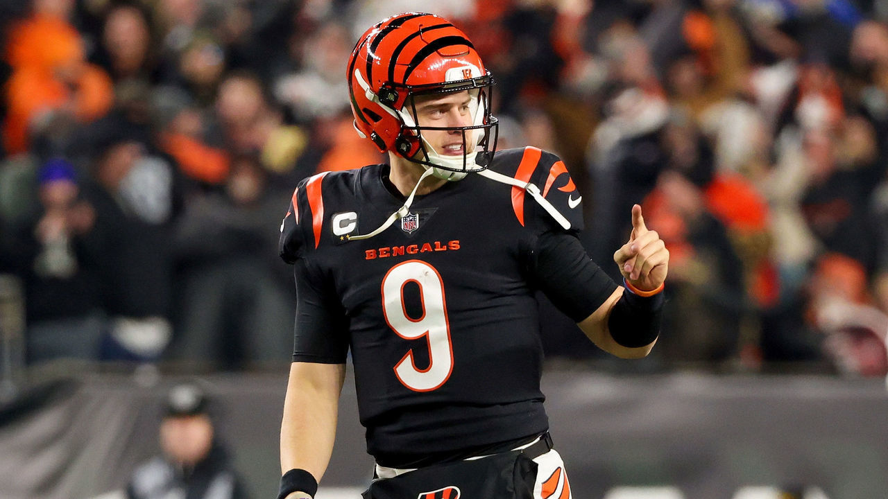 CINCINNATI, OHIO - JANUARY 15: Joe Burrow #9 of the Cincinnati Bengals celebrates in the fourth quarter against the Las Vegas Raiders during the AFC Wild Card playoff game at Paul Brown Stadium on January 15, 2022 in Cincinnati, Ohio.