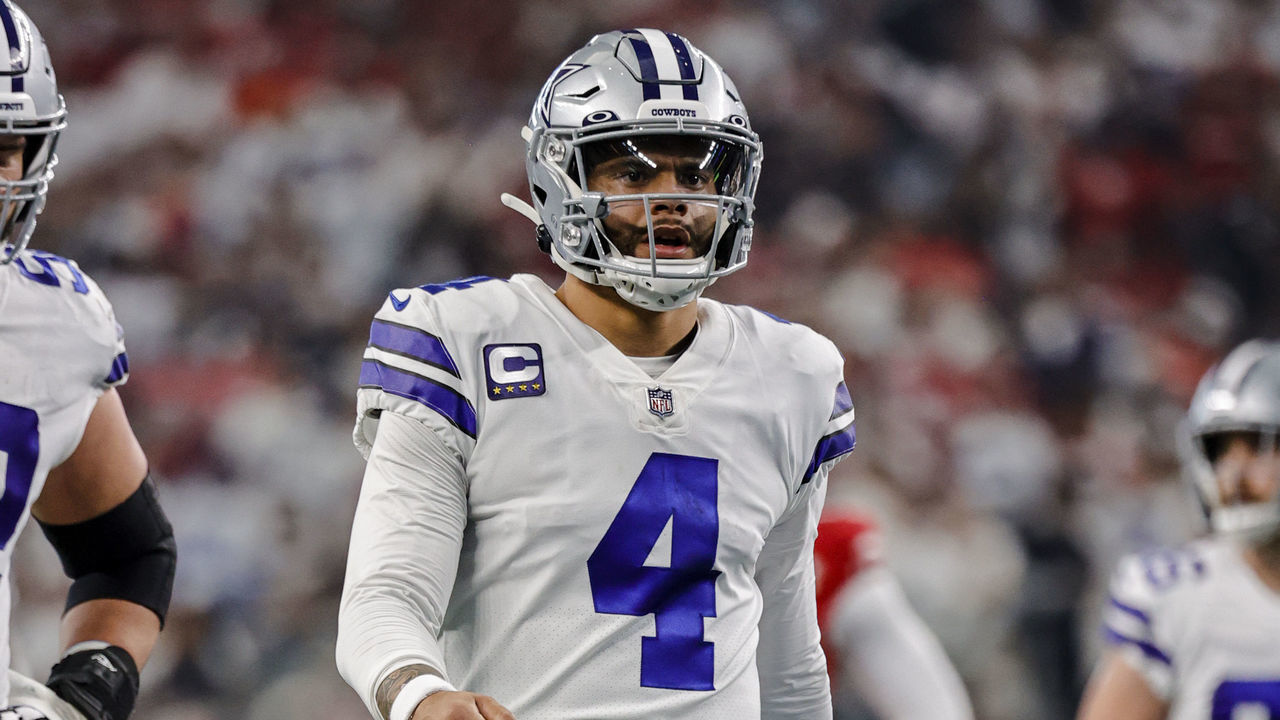 ARLINGTON, TX - JANUARY 16: Dallas Cowboys quarterback Dak Prescott (4) walks back to the huddle during the NFC Wild Card game between the Dallas Cowboys and the San Francisco 49ers on January 16, 2022 at AT&T Stadium in Arlington, Texas.