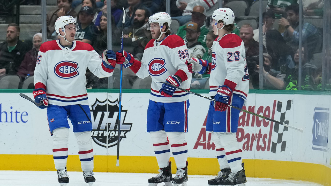 DALLAS, TX - JANUARY 18: Laurent Dauphin #45, Mike Hoffman #68 and Christian Dvorak #28 of the Montreal Canadiens celebrate a goal against the Dallas Stars at the American Airlines Center on January 18, 2022 in Dallas, Texas.