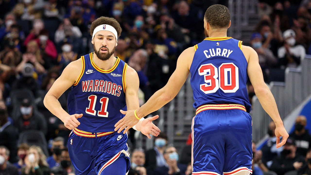 SAN FRANCISCO, CALIFORNIA - JANUARY 18: Klay Thompson #11 high fives Stephen Curry #30 of the Golden State Warriors as he runs back downcourt against the Detroit Pistons at Chase Center on January 18, 2022 in San Francisco, California. NOTE TO USER: User expressly acknowledges and agrees that, by downloading and/or using this photograph, User is consenting to the terms and conditions of the Getty Images License Agreement.