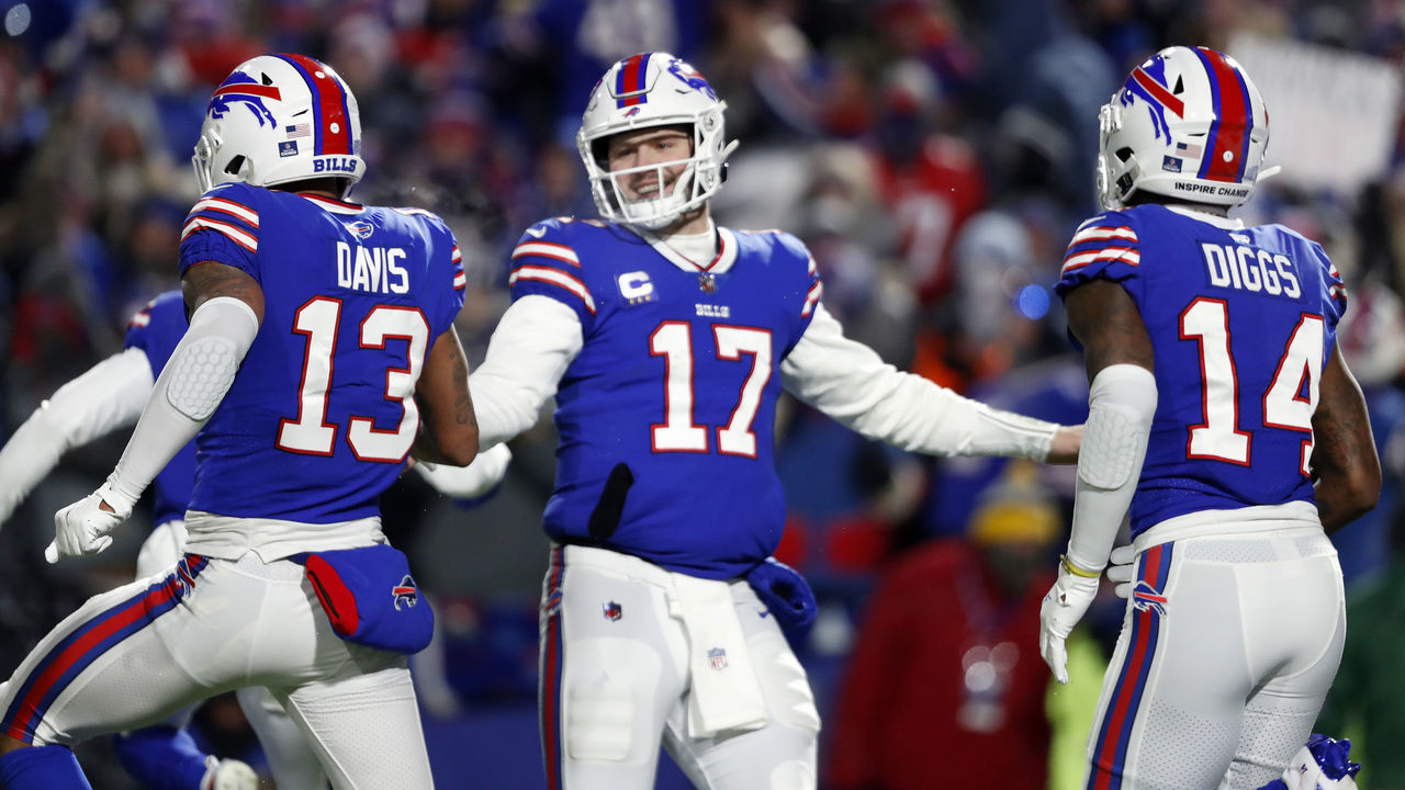 Orchard Park, NY - January 15: Bills quarterback Josh Allen (17) celebrates with WRs Gabriel Davis (left) and Stefon Diggs (right) after a fourth quarter touchdown scored by Davis. The Buffalo Bills host the New England Patriots in a AFC wild-card game Saturday night January 15, 2022 at Highmark Stadium in Orchard Park, NY.