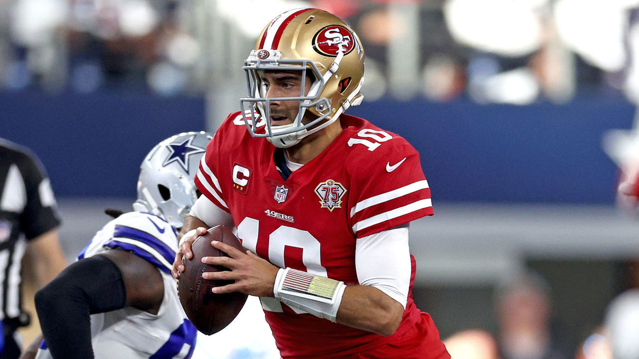ARLINGTON, TEXAS - JANUARY 16: Jimmy Garoppolo #10 of the San Francisco 49ers looks to pass against the Dallas Cowboys during the second quarter in the NFC Wild Card Playoff game at AT&T Stadium on January 16, 2022 in Arlington, Texas.