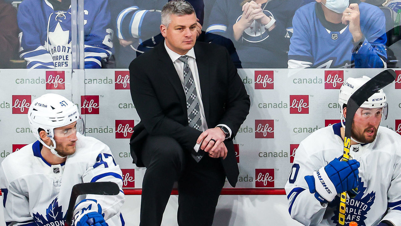 WINNIPEG, MB - DECEMBER 5: Head Coach Sheldon Keefe of the Toronto Maple Leafs looks on from the bench during a third period stoppage in play against the Winnipeg Jets at the Canada Life Centre on December 5, 2021 in Winnipeg, Manitoba, Canada.