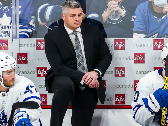 WINNIPEG, MB - DECEMBER 5: Head Coach Sheldon Keefe of the Toronto Maple Leafs looks on from the bench during a third period stoppage in play against the Winnipeg Jets at the Canada Life Centre on December 5, 2021 in Winnipeg, Manitoba, Canada.