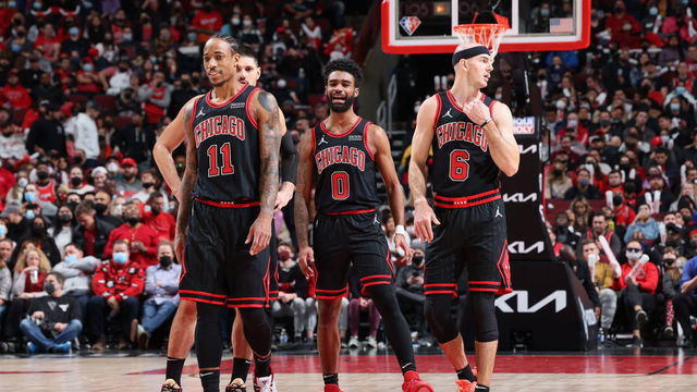 CHICAGO, IL - JANUARY 19: DeMar DeRozan #11, Nikola Vucevic #9, Coby White #0 and Alex Caruso #6 of the Chicago Bulls look on during the game against the Cleveland Cavaliers on January 19, 2022 at United Center in Chicago, Illinois. Mandatory Copyright Notice: Copyright 2022 NBAE
